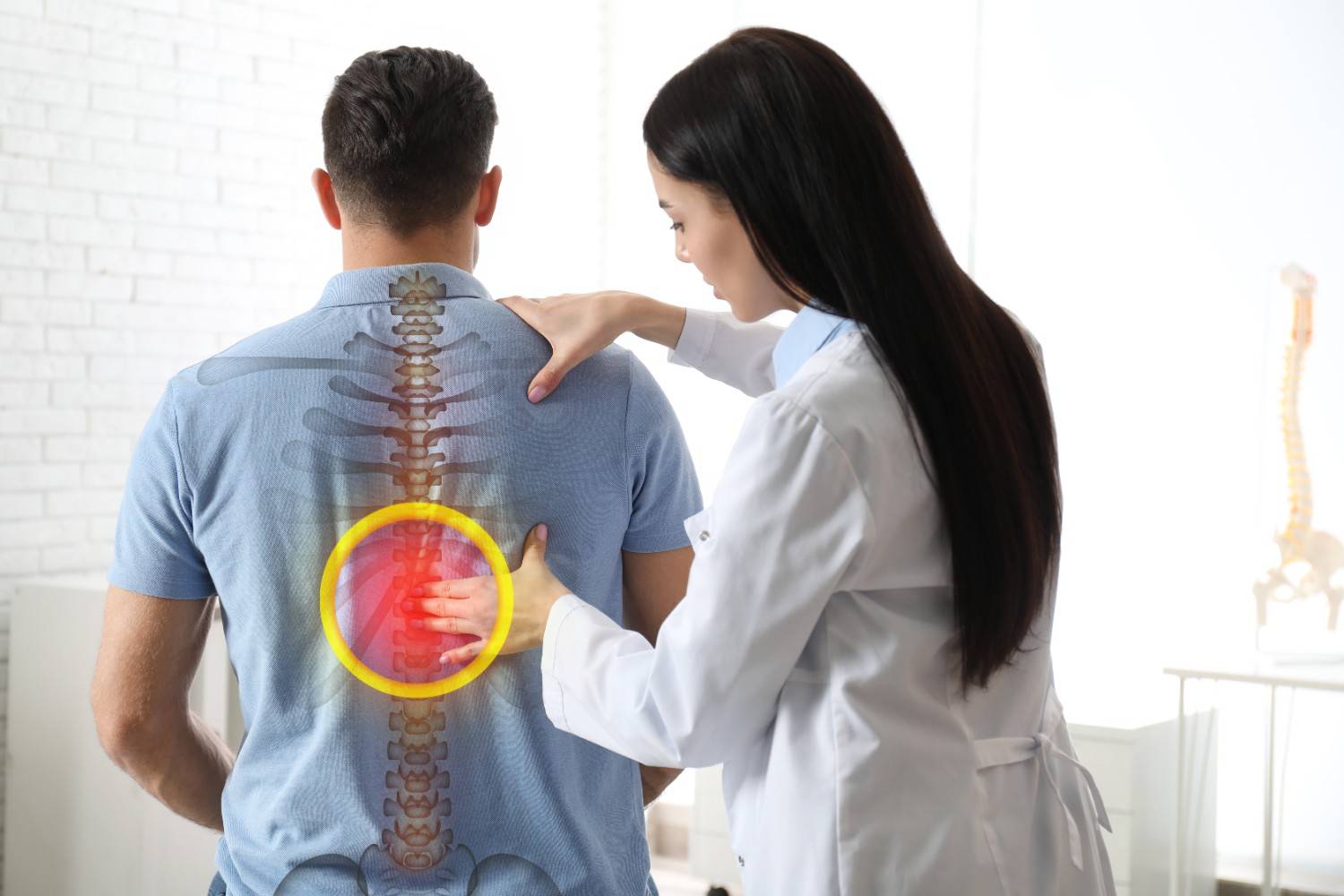 professional-orthopedist-examining-man-medical-office-spinal-pain (1)